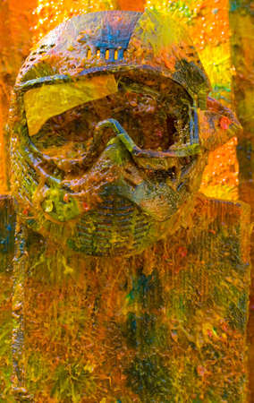 Colored vivid paintball sport protection mask on the fenceの写真素材