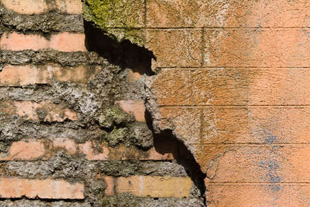 Old and new part of brick wall,texture and backgroundの写真素材