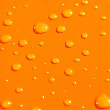 water drops on orange metal macro backgroundの写真素材