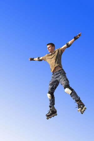 active roller boy jumping on sky
