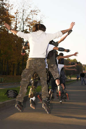 Rollers jumping in parkの写真素材