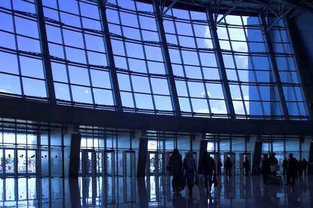 People silhouettes at airport buildingの写真素材