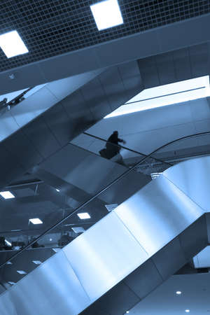 Mooving escalators in airportの写真素材