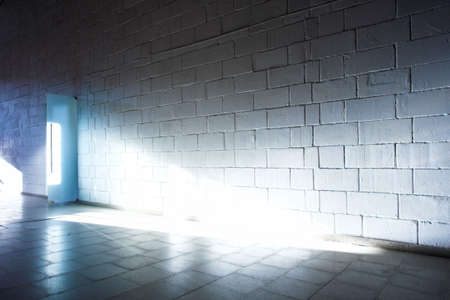 White brick wall and light rayの写真素材