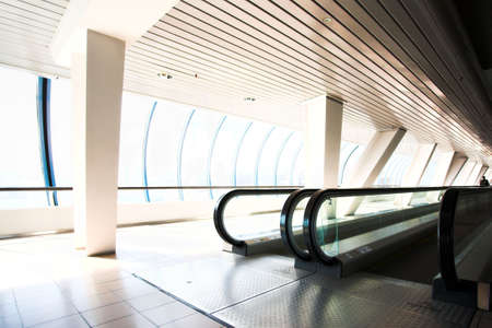 Escalator in corridor in office centreの写真素材