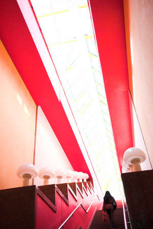 Red interior stair and people movingの写真素材