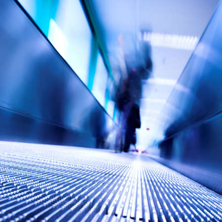 Blue moving escalator in the office hall perspective viewの写真素材