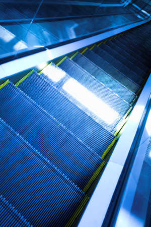 Blue move escalator in modern office centre