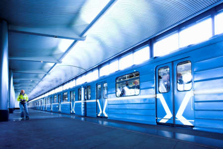 Blue train at subway hall platform
