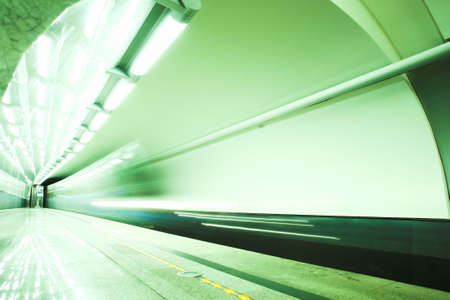 Fast green train subway hall platformの写真素材