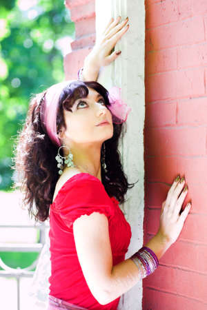 girl in red near church wallの写真素材