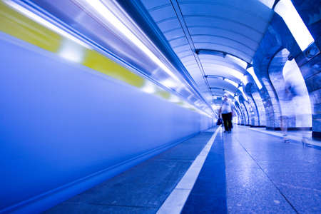 train on platform in subway and people crowd