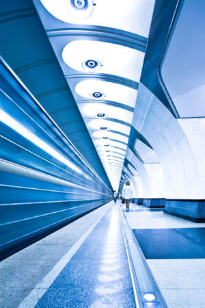 train on platform in subway and  crowdの写真素材