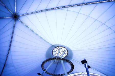 blue unusual geometric ceiling of office building の写真素材