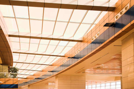 yellow unusual geometric ceiling of office building の写真素材