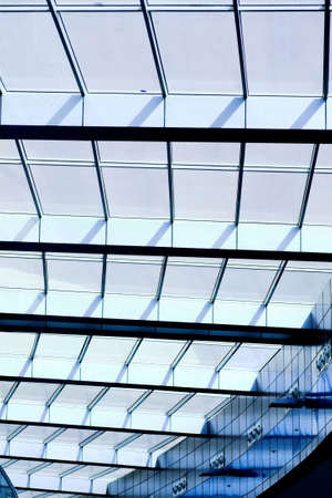 blue unusual geometric ceiling of office building の写真素材