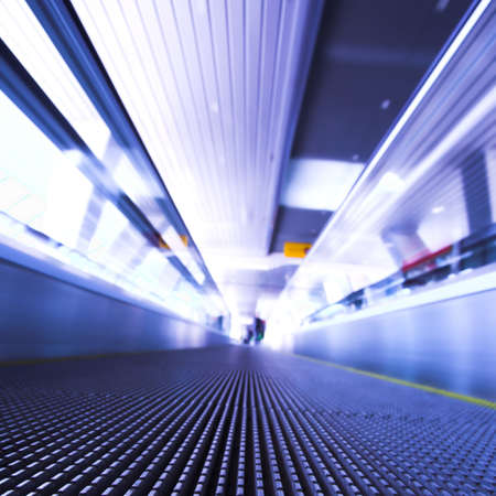 Blue moving escalator in the office hall perspective view