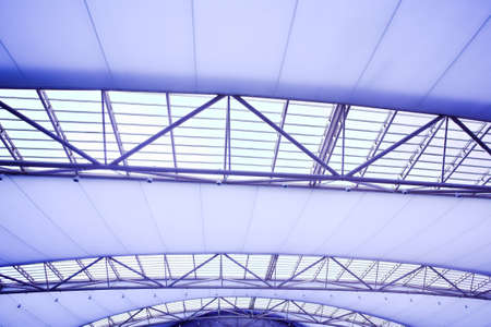 blue unusual geometric ceiling of office building の写真素材