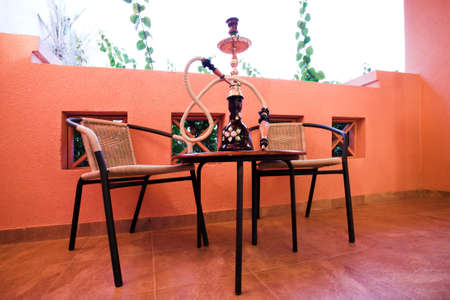 hookah on table and chairs, balconyの写真素材