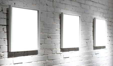 Three frames on white wall in museumの写真素材