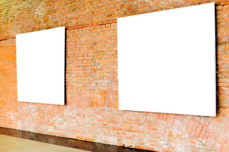 Two frames on brick wall in museumの写真素材