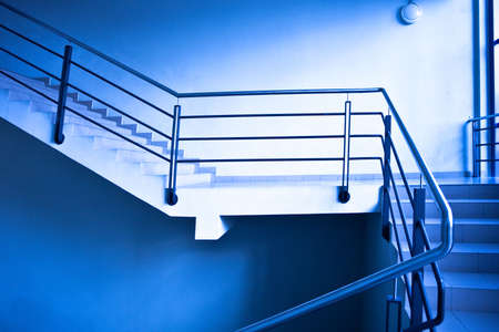 Empty stairs in office in blueの写真素材