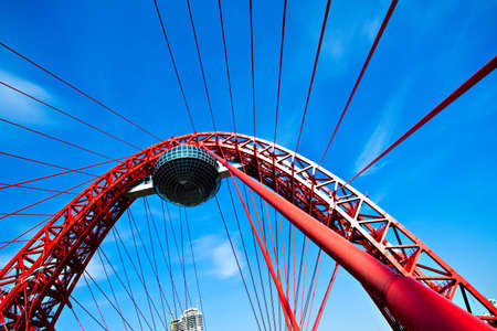 Red suspended bridge construction in Moscow, Russiaの写真素材