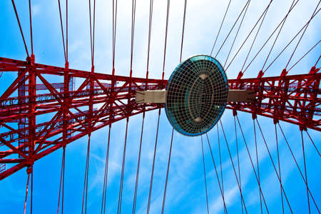 Red suspended bridge construction in the middle of imageの写真素材