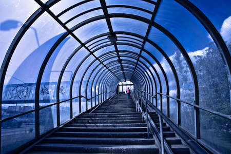 Blue corridor and stairs, people movingの写真素材