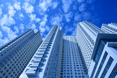 View to new dwelling house against blue sky with clouds, Moscow, Russiaの写真素材
