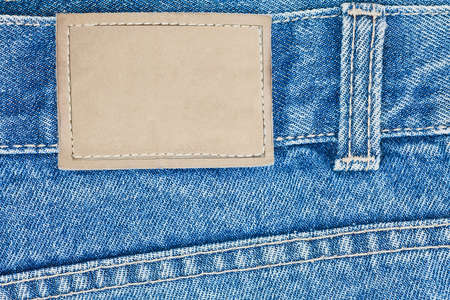 Blank leather label on blue jeansの写真素材