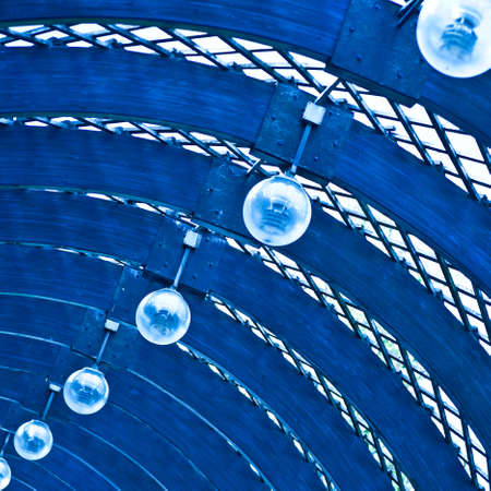 Ball lamps on blue ceilingの写真素材