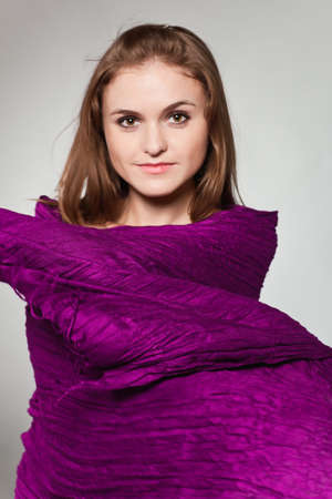 Portrait of young girl with violet scarfの写真素材