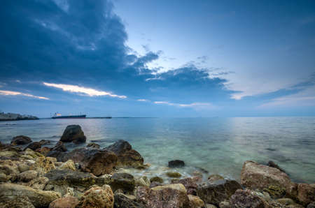 Rich blue sky above the silky oceanの写真素材