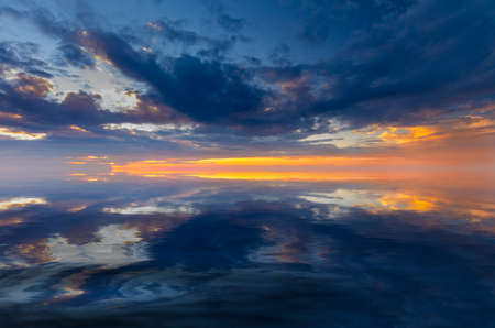 light vivid sunser with pretty clouds at sunsetの写真素材