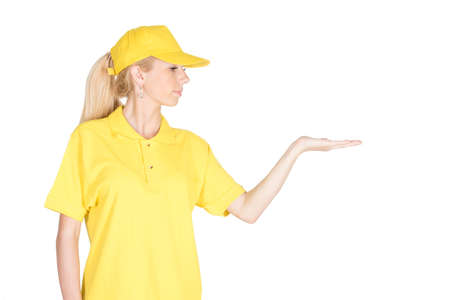 Cute yellow woman courier hold anything what you want and looks at it isolatedの写真素材
