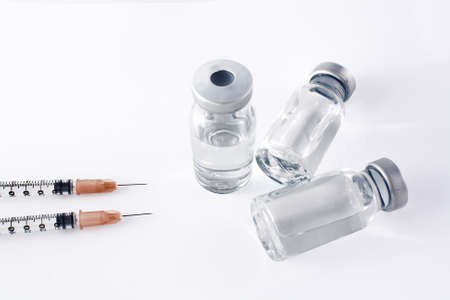 Syringes and fvials over whiteの写真素材