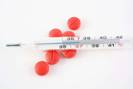 Pills and termomether over whiteの写真素材
