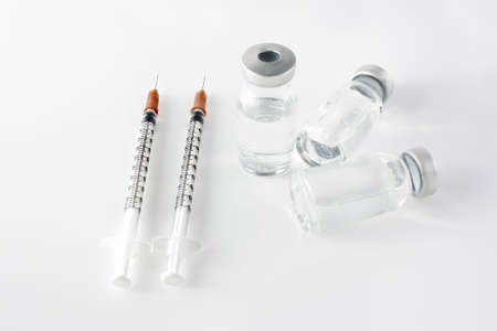 Syringe and vial over white backgroundの写真素材