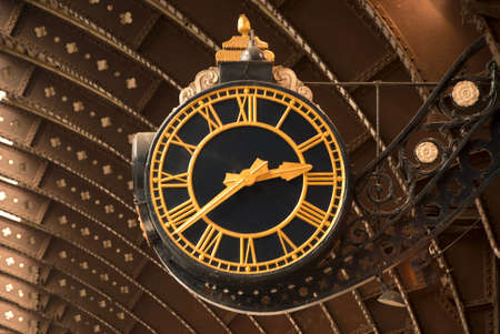 An Antique Black and Gold Railway Station Clockの写真素材