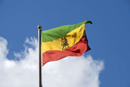 An Ethiopian Flag fluttering in the wind under a blue skyの写真素材
