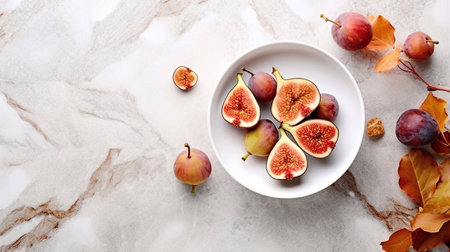 Plate with fresh figs and autumn leavesle table, top viewの素材