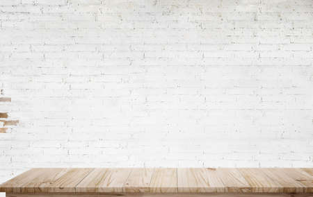 Mock up wooden table with white brick wall. For product display montage.の写真素材