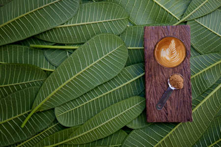 coffee on of green leaves. Flat lay.の写真素材