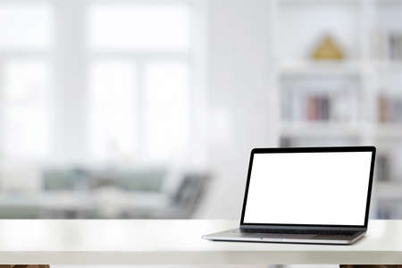 Mockup laptop on white desk at homeの写真素材