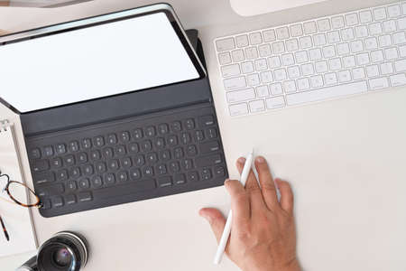Workspace desk with stylish creative supplies, vintage camera and copy space