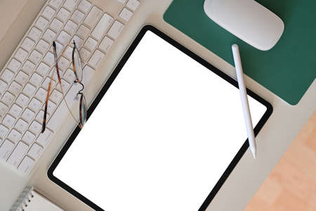 Office desk and blank screen tabletの写真素材