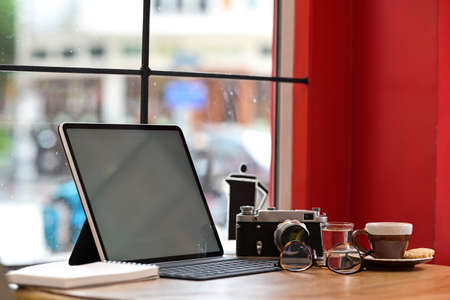 Creative designer or photographer with mockup blank screen tablet