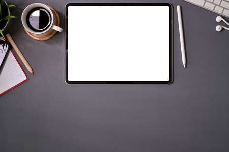 Top view mockup blank screen tablet on office deskの写真素材