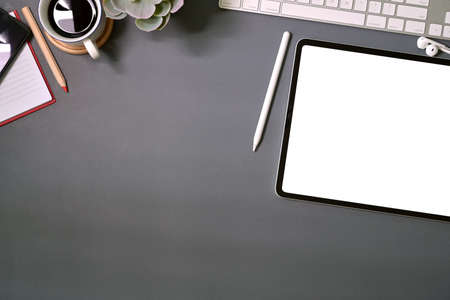 Top view mockup blank screen tablet on office deskの写真素材